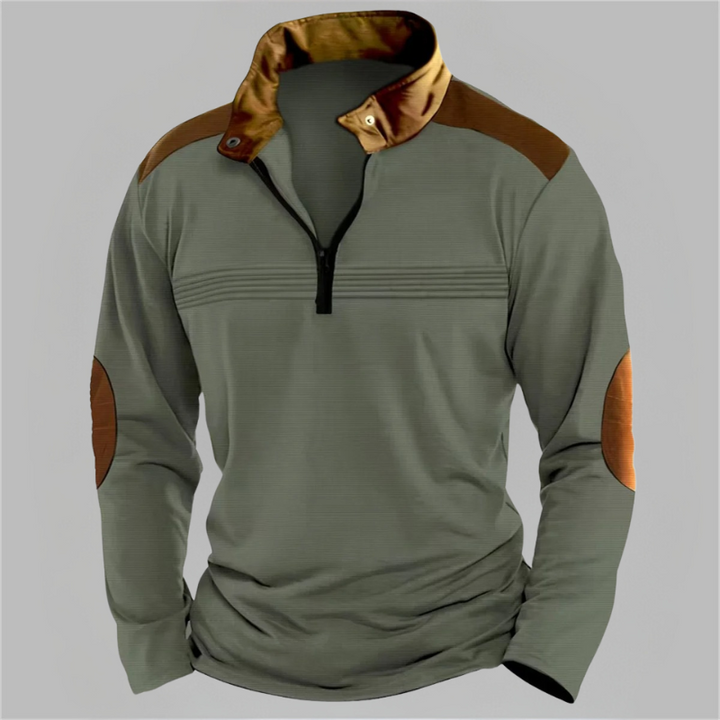 Green long-sleeve shirt with brown accents on a gray background