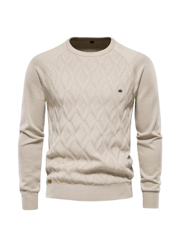 Beige cable knit sweater on a white background