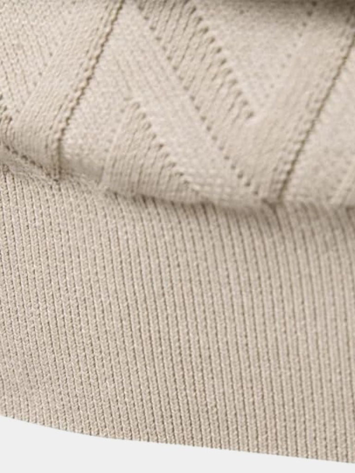 Close-up of beige knitted fabric texture