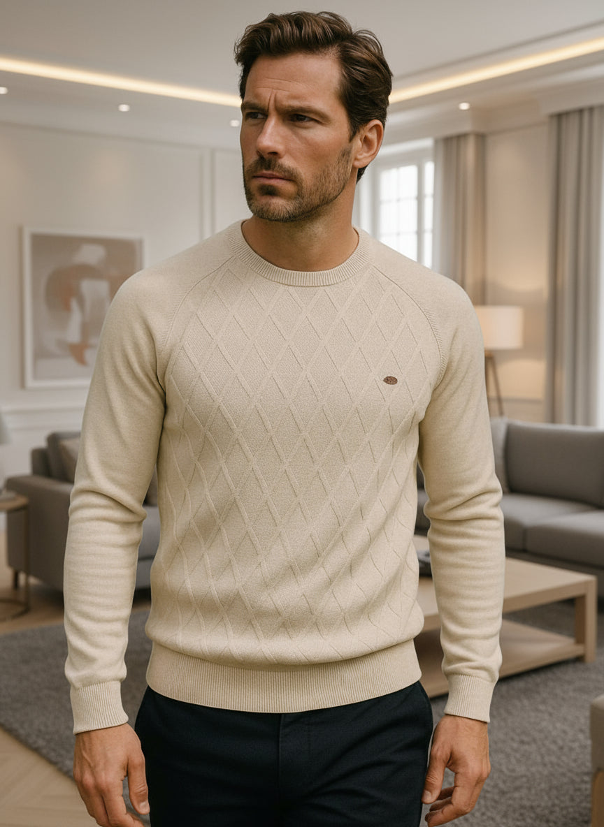 Man wearing a beige sweater in an indoor setting